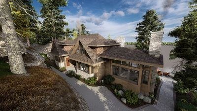 Traditional timber and stone Muskoka estate in a wooded waterfront setting
